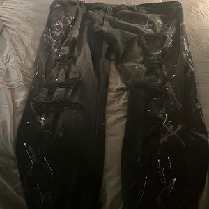 Men’s distressed black jeans with white and purple specs